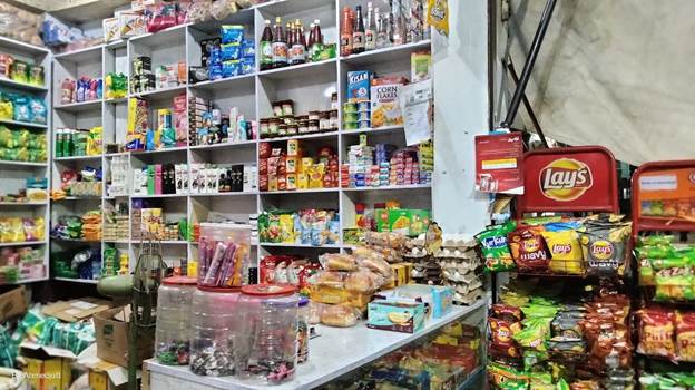 A store with shelves full of food

Description automatically generated