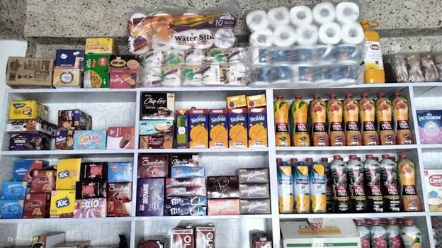 Shelves of food items on a shelf

Description automatically generated